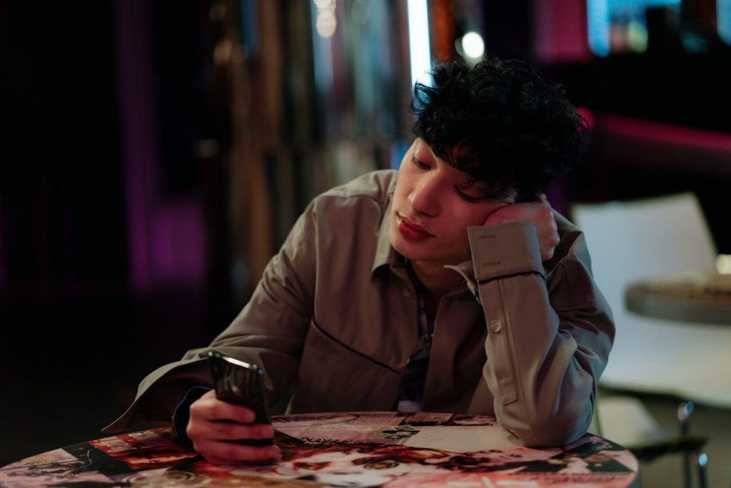 Man Using His Mobile Phone